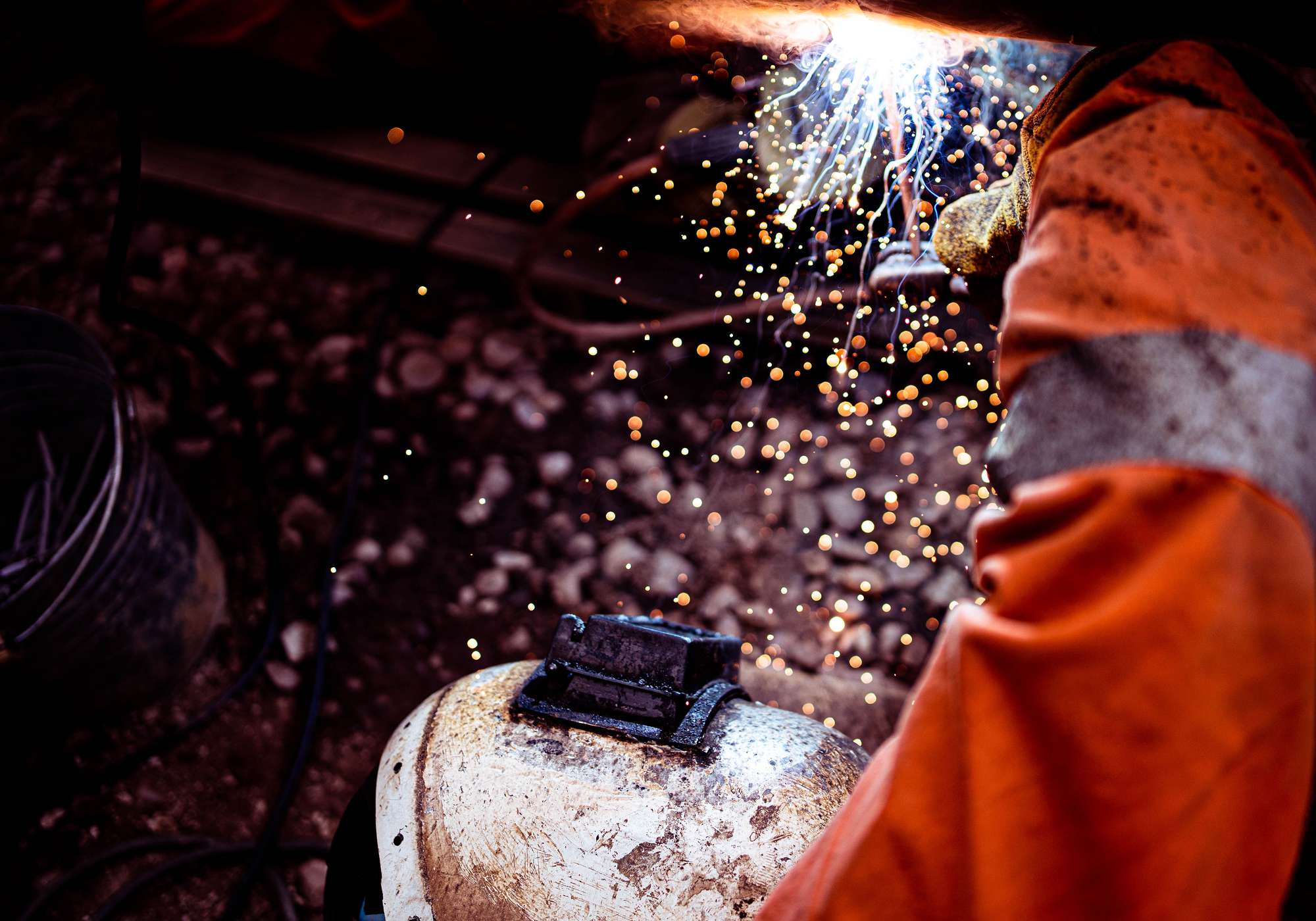 closeup-of-a-worker-welding-the-railroad-FQTP2RG.jpg